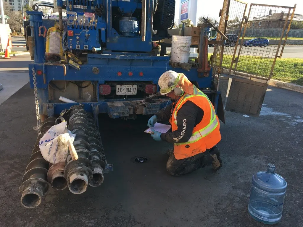 GEO crew advancing a hollow-stem auger borehole
